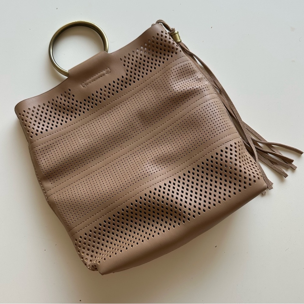 By Anthropologie Perforated Ring Handle Bag.